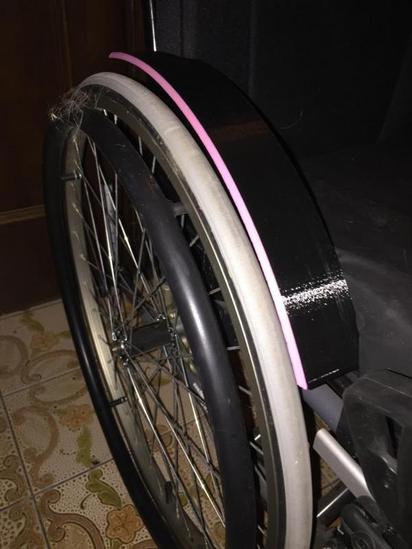 Custom mudguard for the Invacare Action 4 wheelchair.