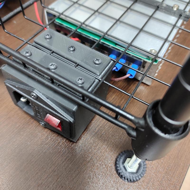 3-pin IEC320 C14 Inlet and fused switch module unit mounter under a DAISO Joint rack wire-meshed shelf