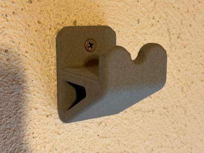 Wand-mounted ladder holder