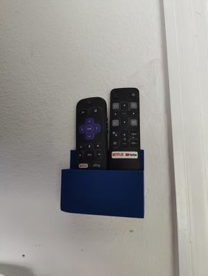 Dual wall mounted remote holder