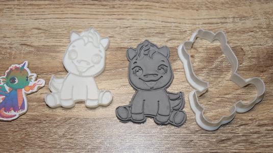 cookie cutter unicorn smiling sitting