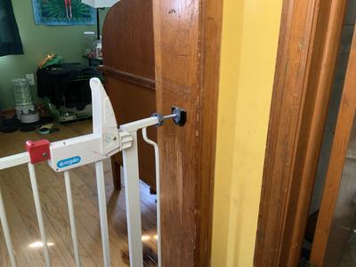 Dog gate foot holder