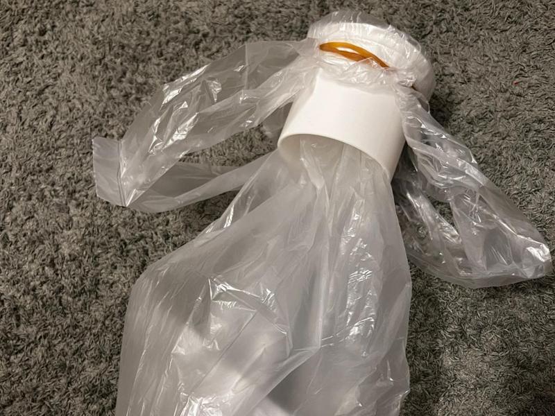 Tool for a DIY vomit bag/sick bag