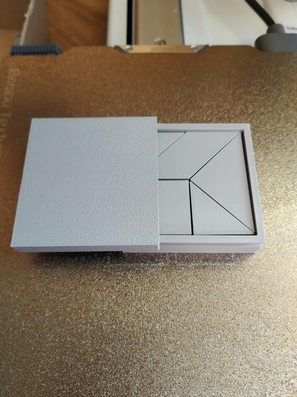 Tangram puzzle with box