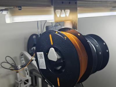 Filament spool holder compatible with hanging tubes