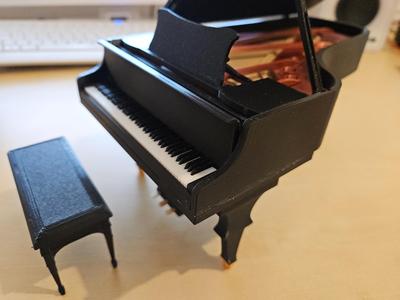 Grand piano with moving parts