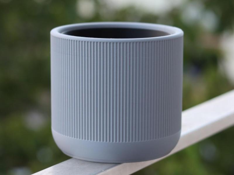 Self-watering plant pot with a narrow design