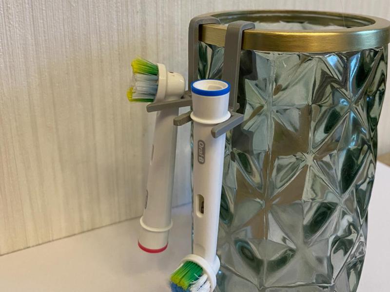 Holder for electric toothbrushes