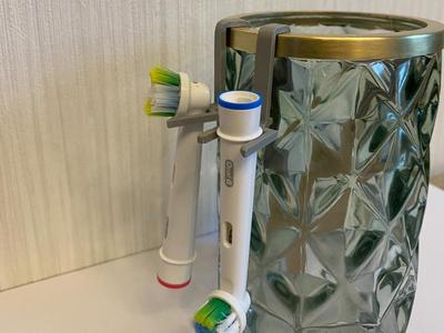 Holder for electric toothbrushes