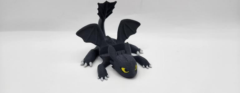 TOOTHLESS PHONE STAND