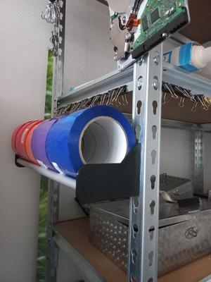 Tape holder for shelving unit