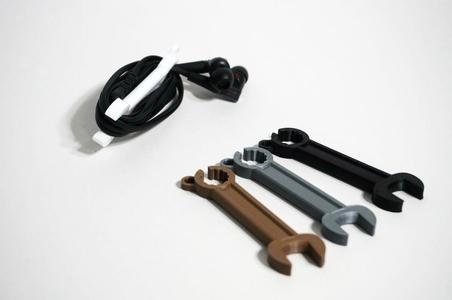 Wrench shaped earphone holder