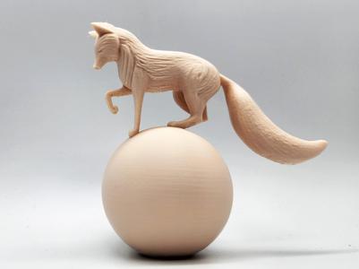 Fox Balancing on a Ball Sculpture