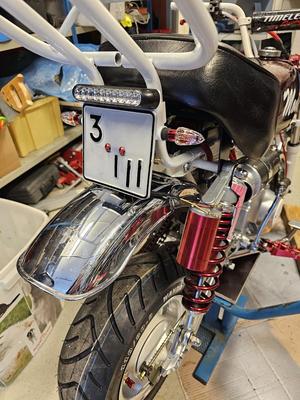 License plate, taillight, and indicator bracket for a Chinese Monkey  (Manki)