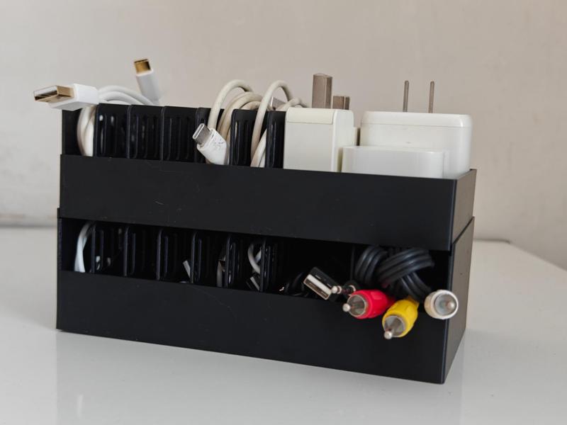 A space-saving and easy-to-categorize storage box for chargers and data cables