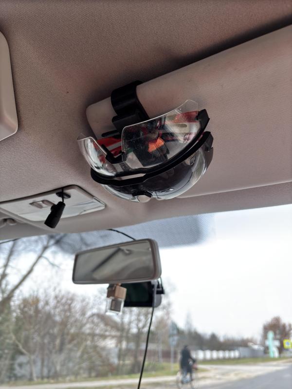 Eyeglass holder with clamp