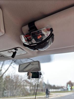Eyeglass holder with clamp