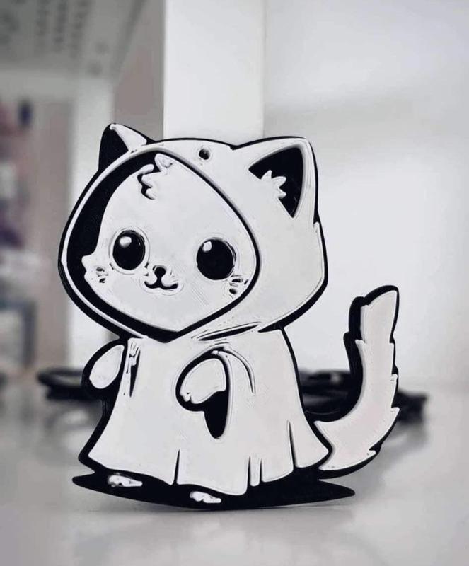 Cute cat in ghost costume