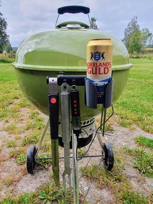 Handle with hooks, hangers and can holder for weber kettle grill.