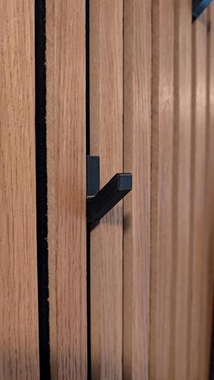 Coat hanger with hidden screwhole