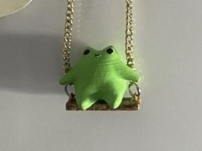 Cute frog on a swing