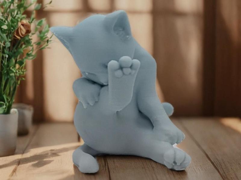 Playful Cat Figurine – Cute and Relaxed Pose