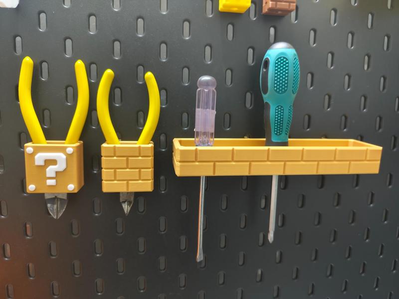 IKEA pegboard accessories—Mario block screwdriver, pliers, and cutter storage set