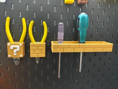 IKEA pegboard accessories—Mario block screwdriver, pliers, and cutter storage set