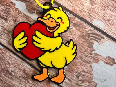 keychain duck holding heart