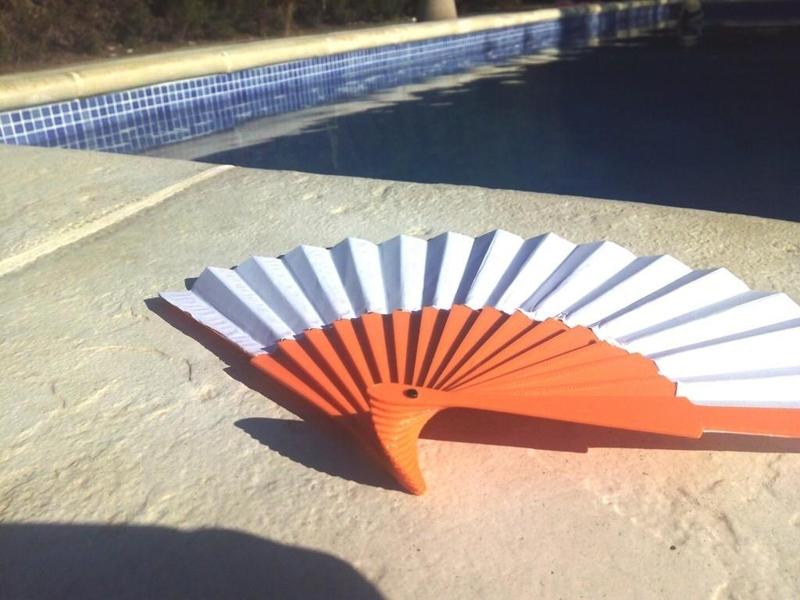 Hand-held foldable fan