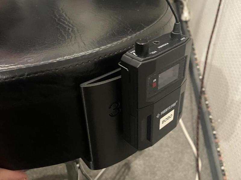 In ear holder for drum throne