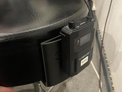 In ear holder for drum throne