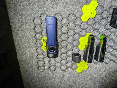 Olight Arkfeld Ultra honeycomb storage wall