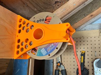 Wall-mounted electrical cable reel