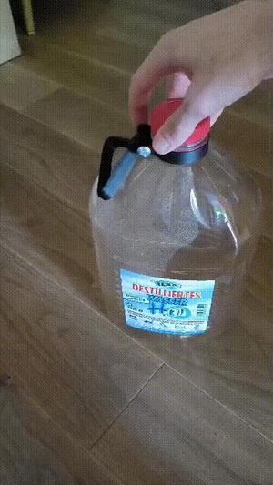 bottle carrier/grip for distilled water container