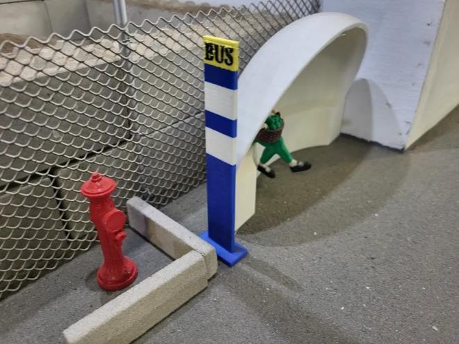 Model scale bus stop sign