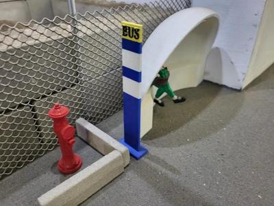 Model scale bus stop sign