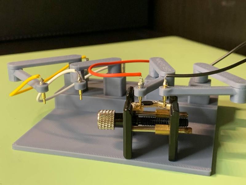 Arms stand for testing quartz watches or PCB