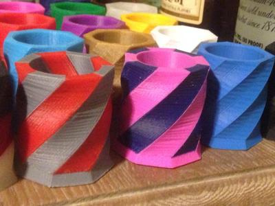 Dual extruder shot glass