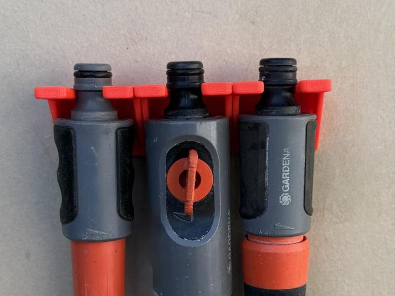 Wall mount for nozzle spray garden irrigation