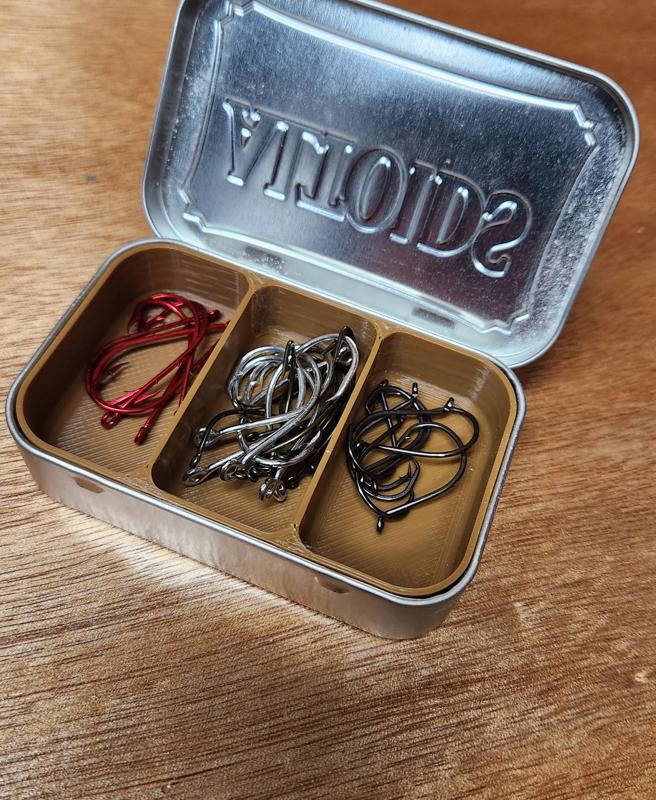 Fish hooks in an Altoids tin