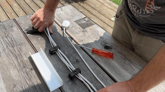 Cable gutter with fasteners and lid