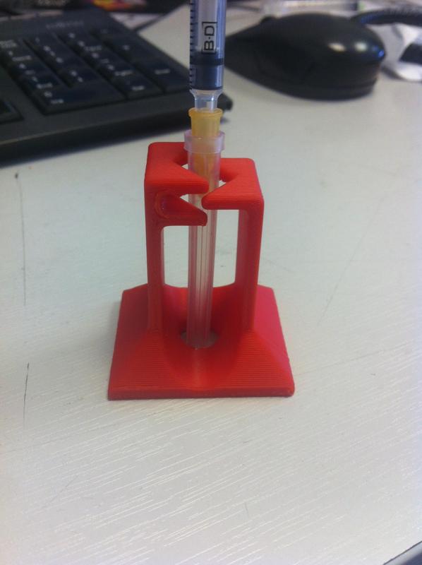 Needle uncapping and recapping device