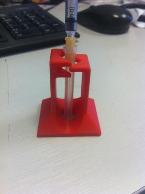 Needle uncapping and recapping device