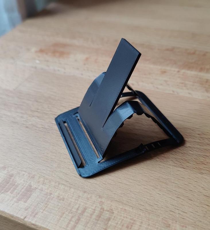 Foldable credit card sized phone holder