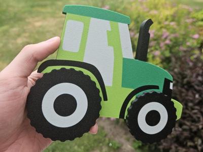 Magnetic tractor toy with rotating wheels