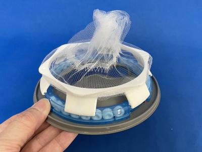 Disinfection and slime removal drain cover net attachment
