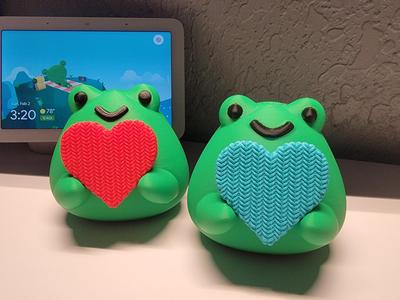 Frog holding knitted heart