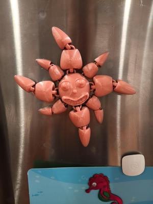 Smiling Sun magnet and flexi fidget toy