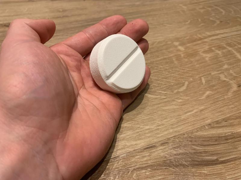 small pill-shaped two-segment pill organizer